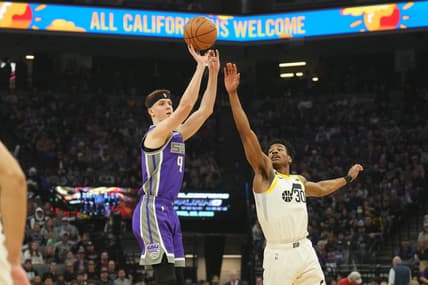Mar 25, 2023; Sacramento, California, USA; Sacramento Kings guard Kevin Huerter (9) shoots against Utah Jazz guard Ochai Agbaji (30) during the first quarter at Golden 1 Center. Mandatory Credit: Darren Yamashita-USA TODAY Sports