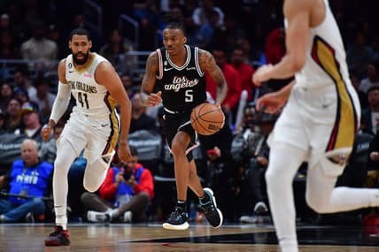 Mar 25, 2023; Los Angeles, California, USA; Los Angeles Clippers guard Bones Hyland (5) moves the ball ahead of New Orleans Pelicans forward Garrett Temple (41) during the second half at Crypto.com Arena. Mandatory Credit: Gary A. Vasquez-USA TODAY Sports