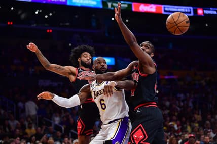 Mar 26, 2023; Los Angeles, California, USA; Los Angeles Lakers forward LeBron James (6) plays for the rebound against Chicago Bulls guard Coby White (0) and forward Patrick Williams (44) during the first half at Crypto.com Arena. Mandatory Credit: Gary A. Vasquez-USA TODAY Sports