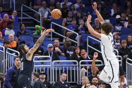 Mar 26, 2023; Orlando, Florida, USA; Orlando Magic guard Markelle Fultz (20) shoots the ball against Brooklyn Nets forward Cameron Johnson (2) during the first quarter at Amway Center. Mandatory Credit: Mike Watters-USA TODAY Sports