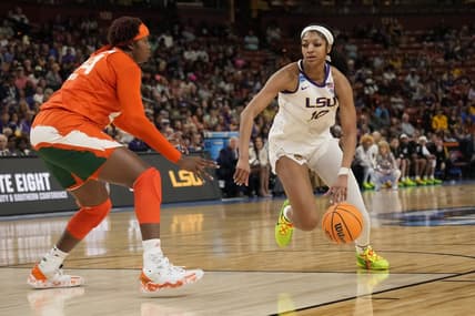 Mar 26, 2023; Greenville, SC, USA; LSU Lady Tigers forward Angel Reese (10) drives to the basket against Miami Hurricanes forward Kyla Oldacre (44) during the NCAA Women   s Tournament at Bon Secours Wellness Arena. Mandatory Credit: Jim Dedmon-USA TODAY Sports