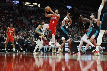 Mar 27, 2023; Portland, Oregon, USA; New Orleans Pelicans shooting guard CJ McCollum (3) drives to the basket past Portland Trail Blazers shooting guard Keon Johnson (6) during the first half at Moda Center. Mandatory Credit: Soobum Im-USA TODAY Sports
