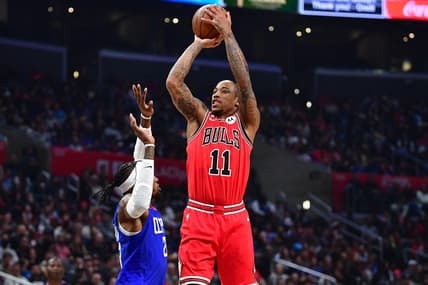 Mar 27, 2023; Los Angeles, California, USA; Chicago Bulls forward DeMar DeRozan (11) shoots against Los Angeles Clippers forward Robert Covington (23) during the first half at Crypto.com Arena. Mandatory Credit: Gary A. Vasquez-USA TODAY Sports