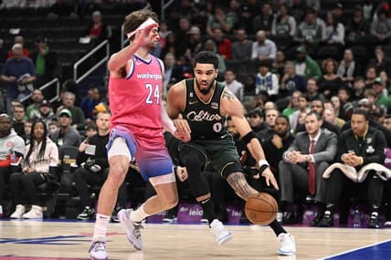 Mar 28, 2023; Washington, District of Columbia, USA; Boston Celtics forward Jayson Tatum (0) dribbles as Washington Wizards forward Corey Kispert (24) defends during the first half at Capital One Arena. Mandatory Credit: Brad Mills-USA TODAY Sports