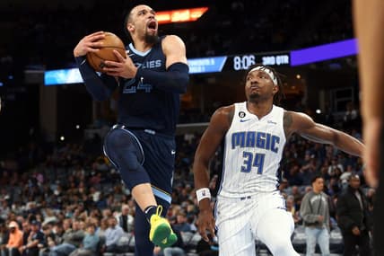 Mar 28, 2023; Memphis, Tennessee, USA; Memphis Grizzlies forward Dillon Brooks (24) drives to the basket as Orlando Magic center Wendell Carter Jr. (34) defends during the second half at FedExForum. Mandatory Credit: Petre Thomas-USA TODAY Sports