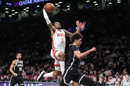 Mar 29, 2023; Brooklyn, New York, USA;  Houston Rockets guard Kevin Porter Jr. (3) goes past Brooklyn Nets forward Cameron Johnson (2) for a dunk attempt in the second quarter at Barclays Center. Mandatory Credit: Wendell Cruz-USA TODAY Sports