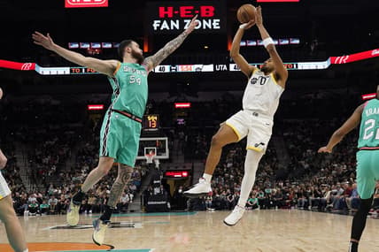 Mar 29, 2023; San Antonio, Texas, USA; Utah Jazz forward Talen Horton-Tucker (0) shoots over San Antonio Spurs forward Sandro Mamukelashvili (54) during the first half at AT&T Center. Mandatory Credit: Scott Wachter-USA TODAY Sports