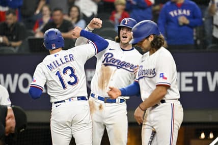 Mar 30, 2023; Arlington, Texas, USA; Texas Rangers designated hitter Brad Miller (13) and catcher Jonah Heim (28) celebrate after Miller hits a two run home run against the Philadelphia Phillies during the fifth inning at Globe Life Field. Mandatory Credit: Jerome Miron-USA TODAY Sports