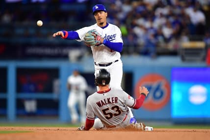 Mar 30, 2023; Los Angeles, California, USA; Arizona Diamondbacks first baseman Christian Walker (53) is out at second as Los Angeles Dodgers second baseman Miguel Vargas (17) throws to first for the out against third baseman Evan Longoria (3) during the first inning at Dodger Stadium. Mandatory Credit: Gary A. Vasquez-USA TODAY Sports