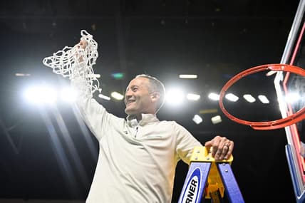 Mar 30, 2023; Las Vegas, NV, USA; North Texas Mean Green head coach Grant McCasland cuts the net after defeating the UAB Blazers to win the NIT Championship at Orleans Arena. Mandatory Credit: Candice Ward-USA TODAY Sports