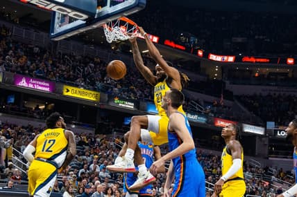 Mar 31, 2023; Indianapolis, Indiana, USA; Indiana Pacers forward Isaiah Jackson (22) shoots the ball while  Oklahoma City Thunder forward Aleksej Pokusevski (17) defends in the first quarter at Gainbridge Fieldhouse. Mandatory Credit: Trevor Ruszkowski-USA TODAY Sports