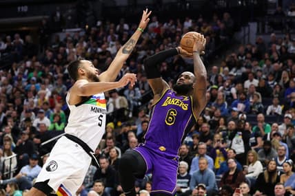 Mar 31, 2023; Minneapolis, Minnesota, USA; Los Angeles Lakers forward LeBron James (6) shoots while Minnesota Timberwolves forward Kyle Anderson (5) defends during the first quarter at Target Center. Mandatory Credit: Matt Krohn-USA TODAY Sports