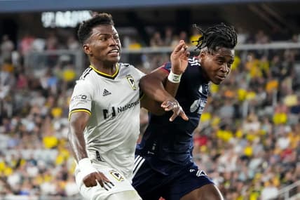Jul 23, 2022; Columbus, Ohio, USA; Columbus Crew midfielder Luis Diaz (12) fights with New England Revolution forward DeJuan Jones (24) to get to a ball during the second half of the MLS soccer game at Lower.com Field. Mandatory Credit: Adam Cairns-The Columbus Dispatch

Mls New England Revolution At Columbus Crew