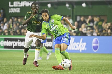Aug 26, 2022; Portland, Oregon, USA; Seattle Sounders midfielder Danny Leyva (75) passes the ball during the second half against Portland Timbers midfielder Diego Chara (21) at Providence Park.The Timbers won 2-1. Mandatory Credit: Troy Wayrynen-USA TODAY Sports