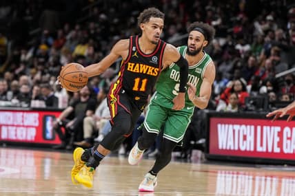 Nov 16, 2022; Atlanta, Georgia, USA; Atlanta Hawks guard Trae Young (11) dribbles past Boston Celtics guard Derrick White (9) during the second half at State Farm Arena. Mandatory Credit: Dale Zanine-USA TODAY Sports