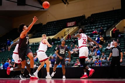 Nov 24, 2022; Orlando, Florida, USA; Oklahoma Sooners guard Grant Sherfield (25) throws a pass to forward Jalen Hill (1) against the Nebraska Cornhuskers during the first half at State Farm Field House. Mandatory Credit: Rich Storry-USA TODAY Sports