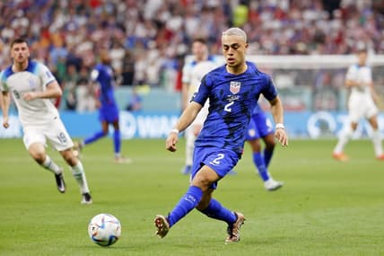 Nov 25, 2022; Al Khor, Qatar; United States of America defender Sergino Dest (2) kicks the ball against England during the second half of a group stage match during the 2022 World Cup at Al Bayt Stadium. Mandatory Credit: Yukihito Taguchi-USA TODAY Sports