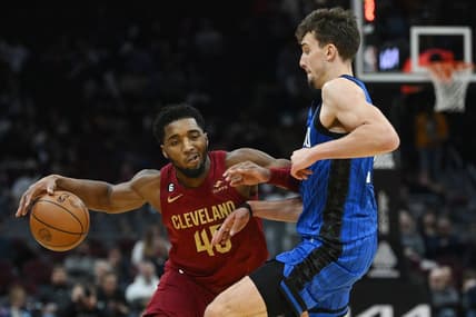 Dec 2, 2022; Cleveland, Ohio, USA; Orlando Magic forward Franz Wagner (22) defends Cleveland Cavaliers guard Donovan Mitchell (45) during the second half at Rocket Mortgage FieldHouse. Mandatory Credit: Ken Blaze-USA TODAY Sports