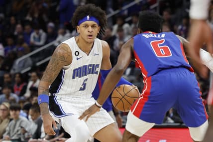 Dec 28, 2022; Detroit, Michigan, USA;  Orlando Magic forward Paolo Banchero (5) dribbles defended by Detroit Pistons guard Hamidou Diallo (6) in the first half at Little Caesars Arena. Mandatory Credit: Rick Osentoski-USA TODAY Sports
