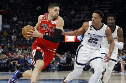 Feb 7, 2023; Memphis, Tennessee, USA; Chicago Bulls center Nikola Vucevic (9) drives to the basket as Memphis Grizzlies guard Desmond Bane (22) defends during the second half at FedExForum. Mandatory Credit: Petre Thomas-USA TODAY Sports