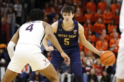 Feb 18, 2023; Charlottesville, Virginia, USA; Notre Dame Fighting Irish guard Cormac Ryan (5) controls the ball as Virginia Cavaliers guard Armaan Franklin (4) defends during the first half at John Paul Jones Arena. Mandatory Credit: Amber Searls-USA TODAY Sports