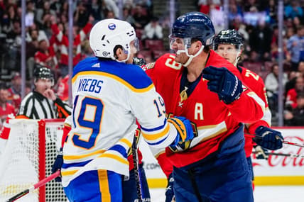 Feb 24, 2023; Sunrise, Florida, USA; Buffalo Sabres center Peyton Krebs (19) and Florida Panthers left wing Matthew Tkachuk (19) fight during the first period at FLA Live Arena. Mandatory Credit: Rich Storry-USA TODAY Sports