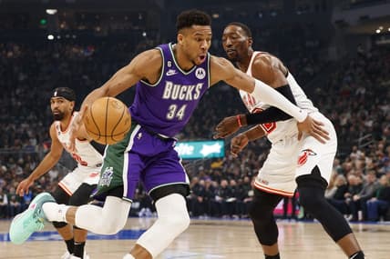 Feb 24, 2023; Milwaukee, Wisconsin, USA;  Milwaukee Bucks forward Giannis Antetokounmpo (34) drives for the basket against Miami Heat center Bam Adebayo (13) during the first quarter at Fiserv Forum. Mandatory Credit: Jeff Hanisch-USA TODAY Sports