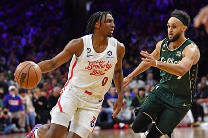 Feb 25, 2023; Philadelphia, Pennsylvania, USA; Philadelphia 76ers guard Tyrese Maxey (0) drives to the basket against Boston Celtics guard Jaylen Brown (7) at Wells Fargo Center. Mandatory Credit: Eric Hartline-USA TODAY Sports