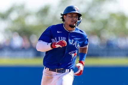Mar 11, 2023; Dunedin, Florida, USA;  Toronto Blue Jays second baseman Santiago Espinal (5) triples against the Baltimore Orioles in the sixth inning during spring training at TD Ballpark. Mandatory Credit: Nathan Ray Seebeck-USA TODAY Sports