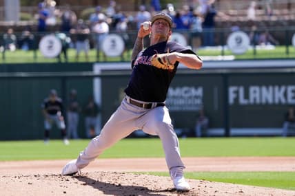 Mar 13, 2023; Phoenix, Arizona, USA; Cleveland Guardians starting pitcher Zach Plesac (34) pitches against the Los Angeles Dodgers during the first inning at Camelback Ranch-Glendale. Mandatory Credit: Joe Camporeale-USA TODAY Sports