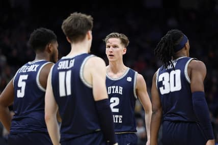 Mar 16, 2023; Sacramento, CA, USA; Utah State Aggies guard Sean Bairstow (2) speaks with guard Max Shulga (11) and guard RJ Eytle-Rock (5) during the first half at Golden 1 Center. Mandatory Credit: Kelley L Cox-USA TODAY Sports