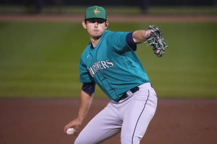 Mar 17, 2023; Peoria, Arizona, USA; Seattle Mariners starting pitcher Chris Flexen (77) pitches against the San Diego Padres during the first inning at Peoria Sports Complex. Mandatory Credit: Joe Camporeale-USA TODAY Sports