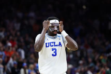 Mar 18, 2023; Sacramento, CA, USA; UCLA Bruins forward Adem Bona (3) adjusts his protective mask during the second half against the Northwestern Wildcats at Golden 1 Center. Mandatory Credit: Kelley L Cox-USA TODAY Sports