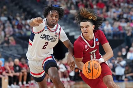 Mar 23, 2023; Las Vegas, NV, USA; Arkansas Razorbacks guard Anthony Black (0) dribbles the ball against UConn Huskies guard Tristen Newton (2) during the first half at T-Mobile Arena. Mandatory Credit: Joe Camporeale-USA TODAY Sports