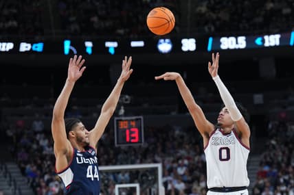 Mar 25, 2023; Las Vegas, NV, USA; Gonzaga Bulldogs guard Julian Strawther (0) shoots the ball against Connecticut Huskies guard Andre Jackson Jr. (44) during the first half for the NCAA tournament West Regional final at T-Mobile Arena. Mandatory Credit: Joe Camporeale-USA TODAY Sports