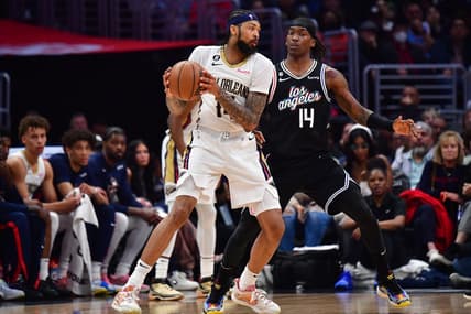 Mar 25, 2023; Los Angeles, California, USA; New Orleans Pelicans forward Brandon Ingram (14) controls the ball against Los Angeles Clippers guard Terance Mann (14) during the second half at Crypto.com Arena. Mandatory Credit: Gary A. Vasquez-USA TODAY Sports