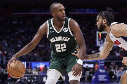 Mar 27, 2023; Detroit, Michigan, USA;  Milwaukee Bucks forward Khris Middleton (22) dribbles defended by Detroit Pistons forward Isaiah Livers (12) in the second half at Little Caesars Arena. Mandatory Credit: Rick Osentoski-USA TODAY Sports