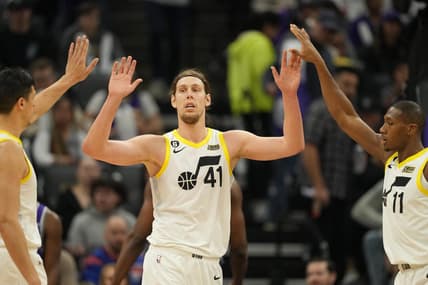 Mar 25, 2023; Sacramento, California, USA; Utah Jazz forward Kelly Olynyk (41) celebrates with forward Simone Fontecchio (left) and guard Kris Dunn (11) during the second quarter against the Sacramento Kings at Golden 1 Center. Mandatory Credit: Darren Yamashita-USA TODAY Sports