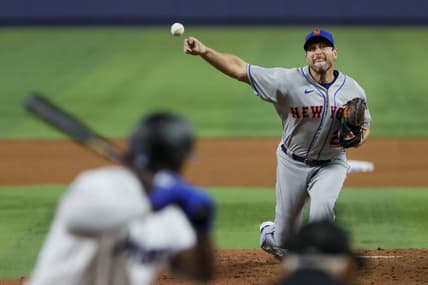 Mar 30, 2023; Miami, Florida, USA; New York Mets starting pitcher Max Scherzer (21) delivers a pitch during the fifth inning against the Miami Marlins at loanDepot Park. Mandatory Credit: Sam Navarro-USA TODAY Sports