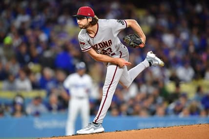 Mar 30, 2023; Los Angeles, California, USA; Arizona Diamondbacks starting pitcher Zac Gallen (23) throws against the Los Angeles Dodgers during the first inning at Dodger Stadium. Mandatory Credit: Gary A. Vasquez-USA TODAY Sports