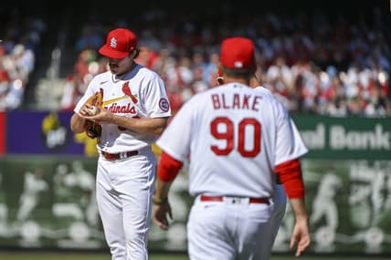 Mar 30, 2023; St. Louis, Missouri, USA;  St. Louis Cardinals starting pitcher Miles Mikolas (39) stands on the mound as pitching coach Dusty Blake (90) walks out during the first inning against the Toronto Blue Jays at Busch Stadium. Mandatory Credit: Jeff Curry-USA TODAY Sports