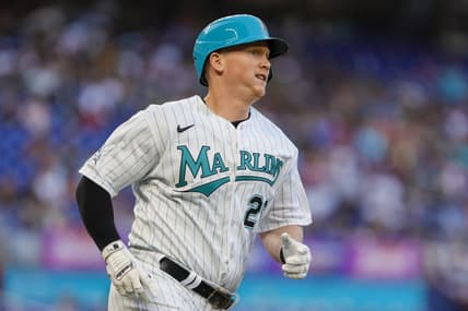 Mar 31, 2023; Miami, Florida, USA; Miami Marlins designated hitter Garrett Cooper (26) runs toward third base after hitting a triple during the first inning against the New York Mets at loanDepot Park. Mandatory Credit: Sam Navarro-USA TODAY Sports