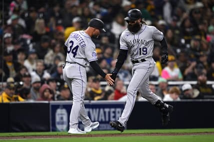 Mar 31, 2023; San Diego, California, USA; Colorado Rockies designated hitter Charlie Blackmon (19) is congratulated by third base coach Warren Schaeffer (34) after hitting a two-run home run during the fifth inning against the San Diego Padresat Petco Park. Mandatory Credit: Orlando Ramirez-USA TODAY Sports