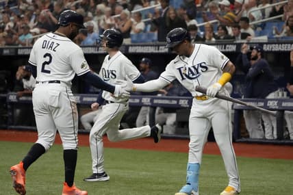 Apr 1, 2023; St. Petersburg, Florida, USA; Tampa Bay Rays first baseman Yandy Diaz (2) is congratulated by shortstop Wander Franco (5) after scoring off of a double by left fielder Randy Arozarena (not pictured) during the first inning at Tropicana Field. Mandatory Credit: Dave Nelson-USA TODAY Sports