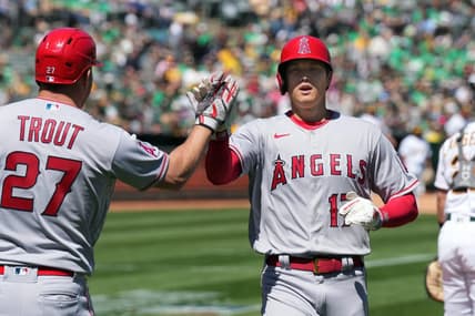 Apr 1, 2023; Oakland, California, USA; Los Angeles Angels designated hitter Shohei Ohtani (17) is congratulated by center fielder Mike Trout (27) after scoring a run against the Oakland Athletics during the third inning at RingCentral Coliseum. Mandatory Credit: Darren Yamashita-USA TODAY Sports