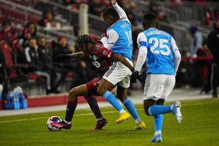 Apr 1, 2023; Toronto, Ontario, CAN; Charlotte FC forward Kerwin Vargas (18) and Toronto FC forward Jahkeele Marshall-Rutty (7) battle for the ball during the first half at BMO Field. Mandatory Credit: John E. Sokolowski-USA TODAY Sports
