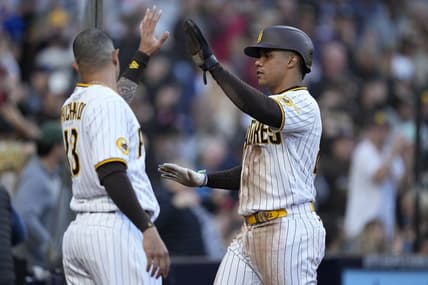 Apr 1, 2023; San Diego, California, USA;  San Diego Padres left fielder Juan Soto (right) greets third baseman Manny Machado (left) after scoring on the double by first baseman Matt Carpenter (not pictured) against the Colorado Rockies during the third inning at Petco Park. Mandatory Credit: Ray Acevedo-USA TODAY Sports