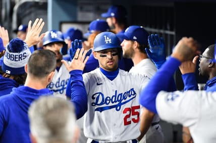 Apr 1, 2023; Los Angeles, California, USA; Los Angeles Dodgers center fielder Trayce Thompson (25) celebrates with teammates in the dugout after hitting a home run against the Arizona Diamondbacks during the fifth inning at Dodger Stadium. Mandatory Credit: Jonathan Hui-USA TODAY Sports