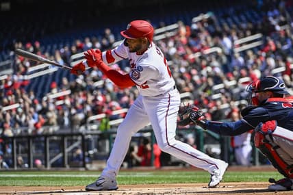 Apr 2, 2023; Washington, District of Columbia, USA; Washington Nationals first baseman Dominic Smith (22) hits an RBI single against the Atlanta Braves during the first inning at Nationals Park. Mandatory Credit: Brad Mills-USA TODAY Sports