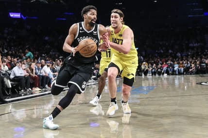 Apr 2, 2023; Brooklyn, New York, USA;  Brooklyn Nets guard Spencer Dinwiddie (26) looks to drive past Utah Jazz forward Kelly Olynyk (41) in the second quarter at Barclays Center. Mandatory Credit: Wendell Cruz-USA TODAY Sports